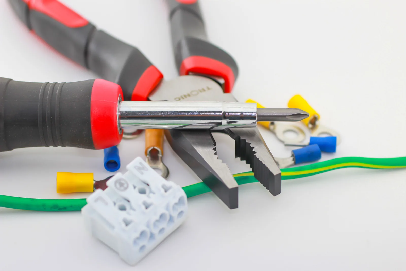 Pliers, a screwdriver, ferrules and a connector block, for electrician in Toronto